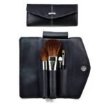 Makeup brush set in modern case made from black soft material, perfect for traveling. Brushes in the set: blusher, powder, lip-liner, applicator.﻿