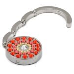 Purse hanger Sun Orange – small women accessory that makes it easy to take care of the bag. Design made with SWAROVSKI