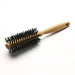 A medium beech wood round brush is a great help for finishing hair.