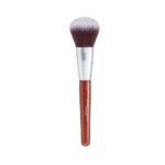 A synthetic powder brush with a luxurious dark mahogany handle