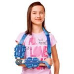 Children's elbow orthosis with simple dressing, adjustment and maintenance. The frame of the orthosis is made of duralumin, the elbow and forearm sleeves are made of breathable padded material. Individually adjustable shoulder strap with padding around the neck. The forearm part is extended by an adjustable wrist module relieving the wrist.