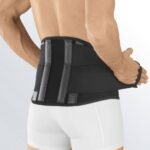 Lumbar belt made of compression material with 4 integrated stabilizing reinforcements. With the help of tightening circular straps, which cause compression in the abdominal area and support the muscles of the torso, we achieve relief of the lumbar spine and subsequent relief of pain.