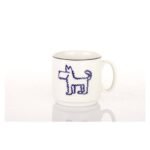 Porcelain mug with a one-sided dog motif and a red stripe along the edge.