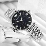 WOMEN'S WATCH EMPORIO ARMANI AR11091. The case is made of polished stainless steel, the bottom of the case, approved by the geschraubter, a fluted winding head made of dark blue kabuchon.