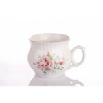 Decorated mug shape rather from thinner porcelain in a decor of delicate flowers with a blue line.