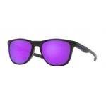 OAKLEY OO9340 03 TRILLBE X. The model has a black frame and is equipped with Violet Iridium Polarized lenses.