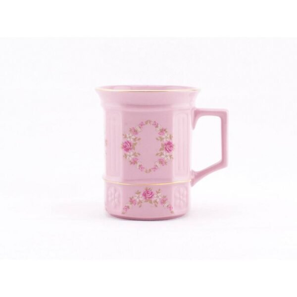 Square porcelain mug made of pink porcelain in a decor of flowers with gold.
