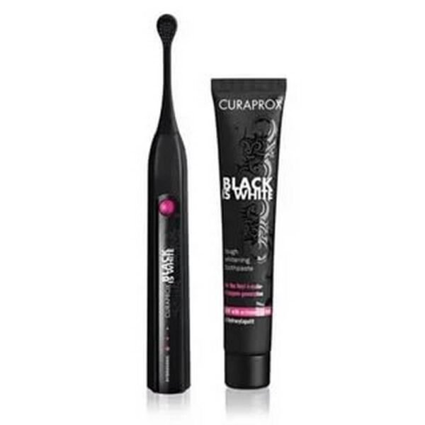 Black sonic toothbrush including black toothpaste with activated charcoal.