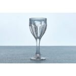 White wine glass with elegantly shaped leg and patterned goblet.